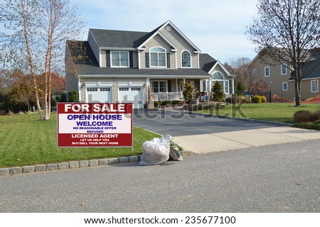 Real Estate for sale open house welcome sign Suburban McMansion home autumn day residential neighborhood USA