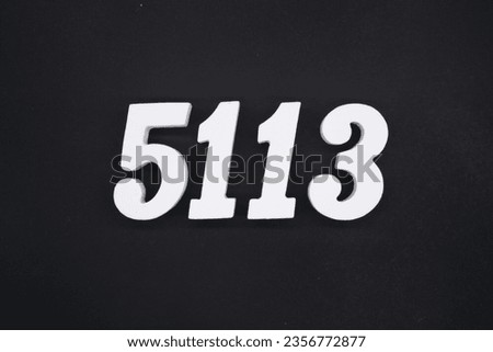 Black for the background. The number 5113 is made of white painted wood.