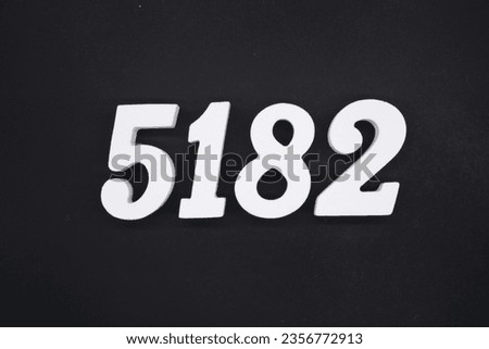 Black for the background. The number 5182 is made of white painted wood.