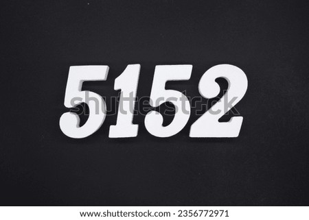 Black for the background. The number 5152 is made of white painted wood.
