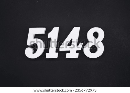 Black for the background. The number 5148 is made of white painted wood.