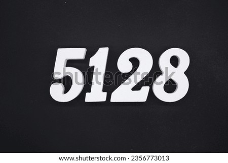 Black for the background. The number 5128 is made of white painted wood.