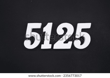 Black for the background. The number 5125 is made of white painted wood.