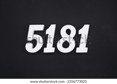 Black for the background. The number 5181 is made of white painted wood.