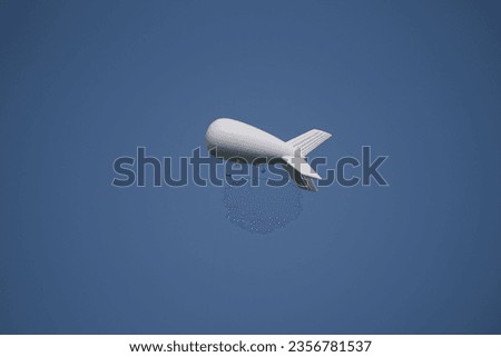 AIRSHIP - Flying object against the blue sky
