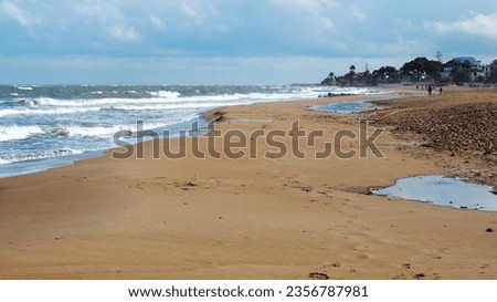 
Denia, Alicante, Valencia, Costa Blanca, Spain -01-11-2020: coast of the mediterranean sea, deserted sandy beach, surf,