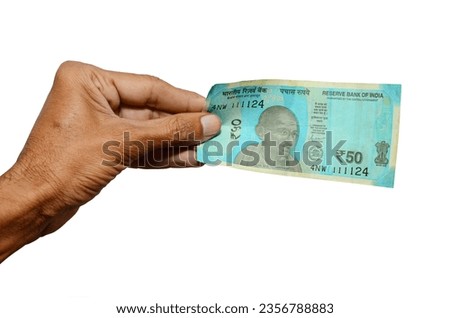 Closeup of hand hold Indian new currency 50 rupees bank note. Royalty-Free Stock Photo #2356788883