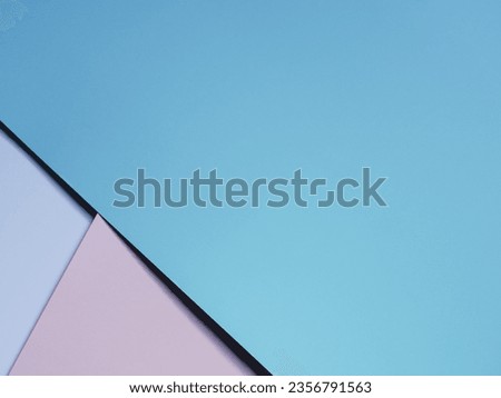 Pastel pink, blue and white cardboard sheets for a simple, minimalist background.