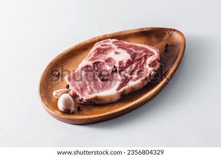 ribeye steak with wooden bowl on white background