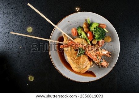 mixed grilled bbq seafood skewer platter big tiger pawn stick with deep fried spring chicken and vegetables tomato salad in plate on marble table western cuisine halal food hotel luxury cafe menu