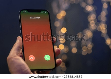 Incoming call screen from Sale 2024, close up.