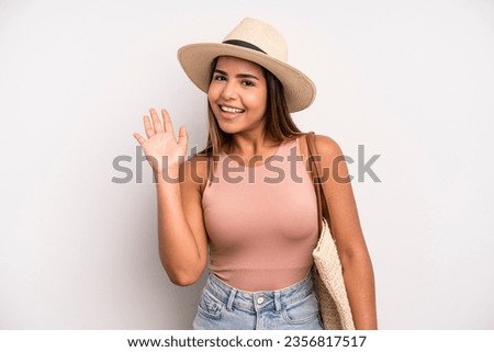 hispanic pretty woman smiling happily, waving hand, welcoming and greeting you. summer holidays concept