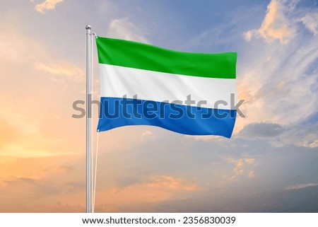 Sierra Leone flag waving on sundown sky