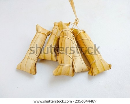 Indonesian traditional food called Lepet or Leupeut, made from glutinous rice and grated coconut, then wrapped in coconut leaves. Popular during Ramadhan and Eid al Fitr