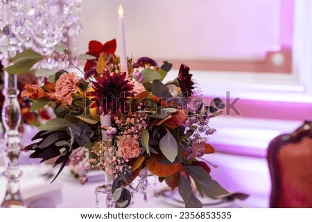 red autumn bouquet on the festive table