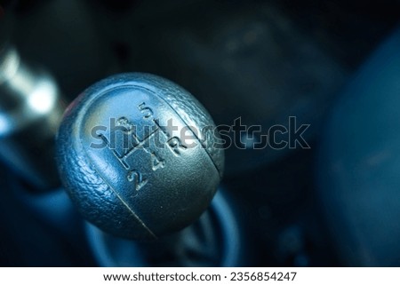 Old style of gear shifter, classic vintage on manual car with 5 speed on blurred background. Space for text or logo etc.,  Royalty-Free Stock Photo #2356854247