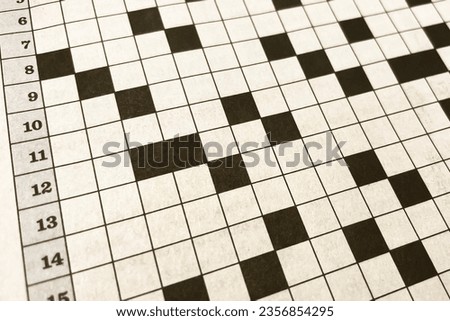 Close up of a black and white checkerboard crossword puzzle