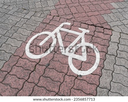 White Bicycle Symbol on Paver Stone Sidewalk in Germany