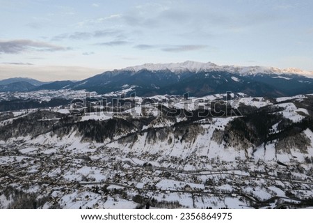 Snowy mountain range captured from a drone in Moeciu Aerial Drone Moeciu Brasov