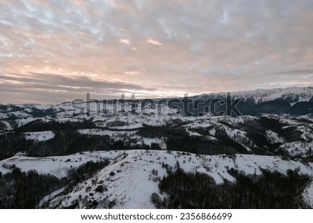 Snow-covered mountain range captured from a drone in Moeciu Aerial Drone Moeciu Brasov