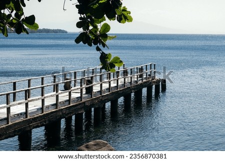 The wooden bridge that functions as a dock for small boats and also a photo spot for tourists to see the sunset is located at Cassabonely Resto and Cafe in Wairterang, Maumere, Flores, Indonesia