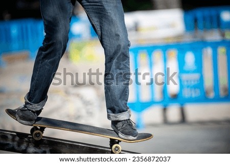 Cutaway view of a designer man in black sneakers and skateboard jeans