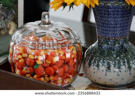 An autumn display on a dining room table.