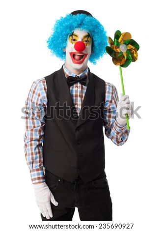 portrait of a funny clown holding a pinwheel