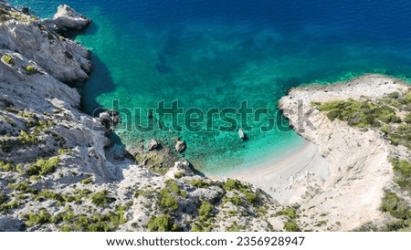 Aerial drone photo of secluded paradise white beach inly accessible by boat resembling shipwreck beach of Zakynthos in Perachora, Corinthia, Greece