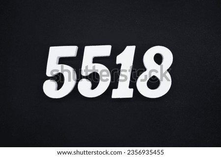 Black for the background. The number 5518 is made of white painted wood.