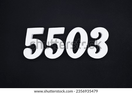 Black for the background. The number 5503 is made of white painted wood.