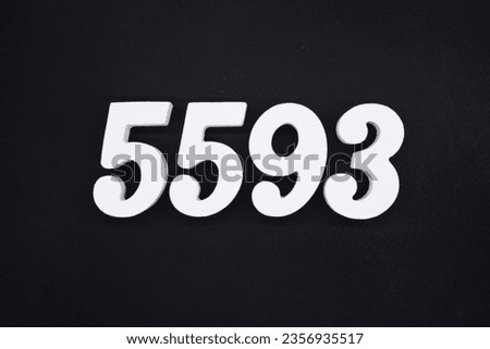 Black for the background. The number 5593 is made of white painted wood.