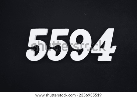 Black for the background. The number 5594 is made of white painted wood.