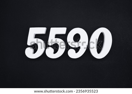 Black for the background. The number 5590 is made of white painted wood.