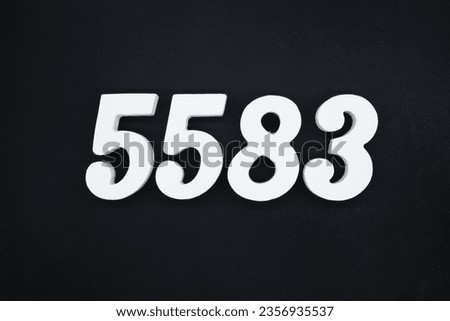 Black for the background. The number 5583 is made of white painted wood.