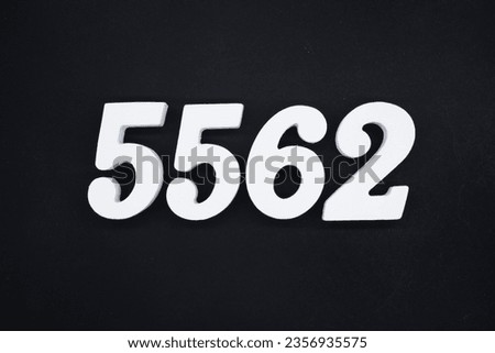Black for the background. The number 5562 is made of white painted wood.