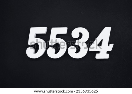 Black for the background. The number 5534 is made of white painted wood.