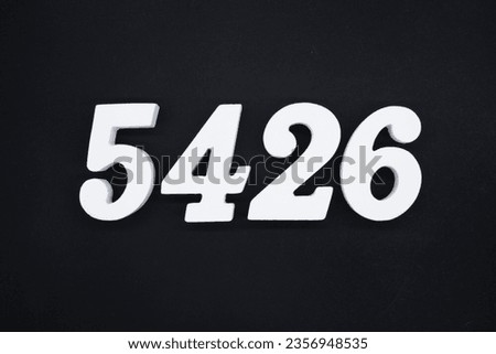 Black for the background. The number 5426 is made of white painted wood.