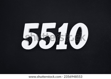 Black for the background. The number 5510 is made of white painted wood.