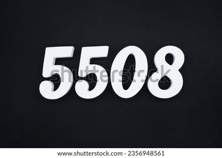 Black for the background. The number 5508 is made of white painted wood.