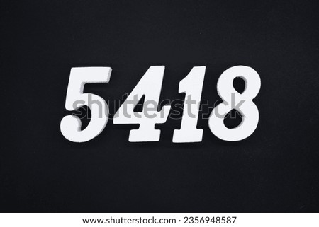 Black for the background. The number 5418 is made of white painted wood.