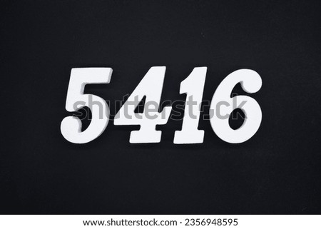 Black for the background. The number 5416 is made of white painted wood.