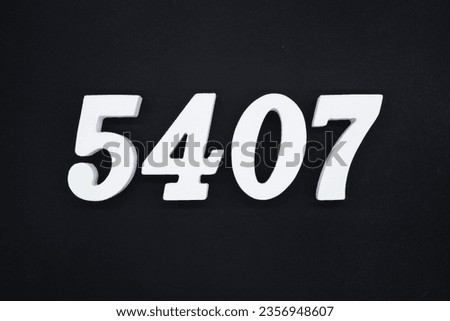 Black for the background. The number 5407 is made of white painted wood.