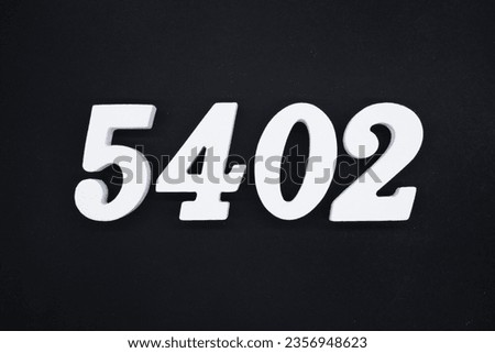 Black for the background. The number 5402 is made of white painted wood.