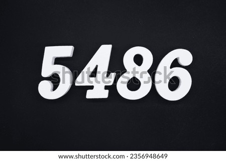 Black for the background. The number 5486 is made of white painted wood.