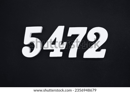 Black for the background. The number 5472 is made of white painted wood.
