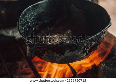 pictures of cooking pots on the fire.