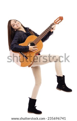 Full length portrait of happy teenage girl playing guitar isolated on white background 