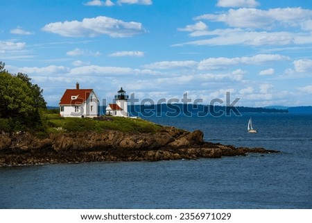 Curtis Island Light is a lighthouse marking the approach to the harbor of Camden, Maine. It is located on Curtis Island, which shelters the harbor from ocean storms.  Royalty-Free Stock Photo #2356971029