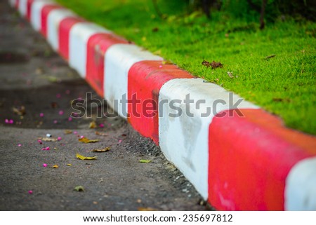 Red and white road barrier 